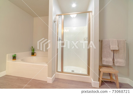 Interior of modern bathroom with brass fittings 73068721