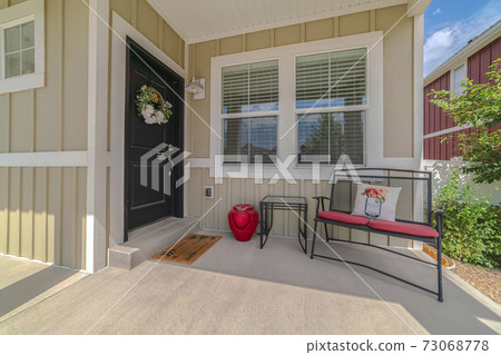 Front porch and door of traditional suburban home Front porch and door of traditional suburban home 73068778