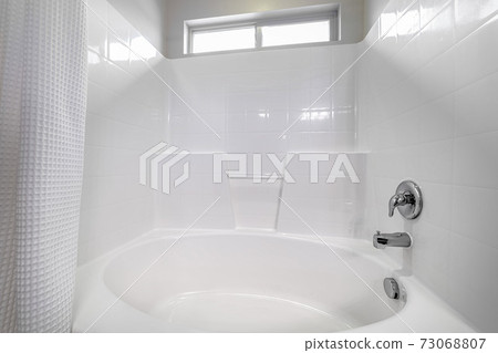 Fitted white oval bath in a compact bathroom Fitted white oval bath in a compact bathroom 73068807