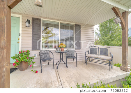 Front veranda of modern home and outdoor furniture 73068812