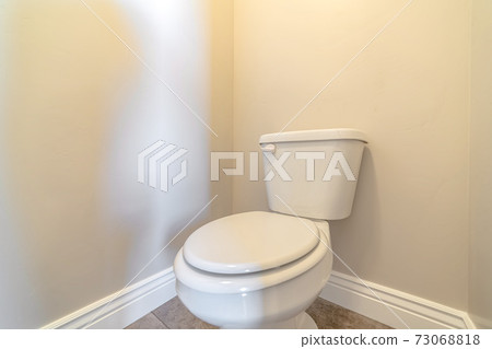 White toilet and cistern in a bathroom White toilet and cistern in a bathroom 73068818