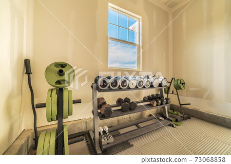 Selection of free weights for weightlifting in garage Selection of free weights for weightlifting in garage 73068858