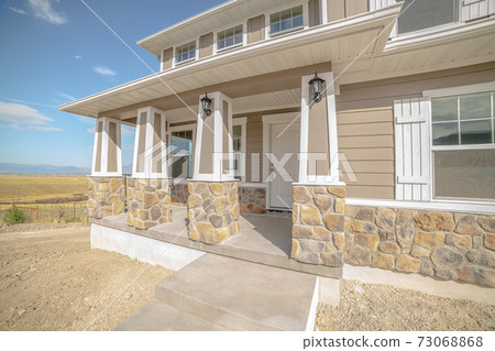 Front porch and door of new two storey home Front porch and door of new two storey home 73068868