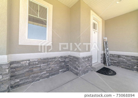 Front door and veranda of home with welcome sign Front door and veranda of home with welcome sign 73068894