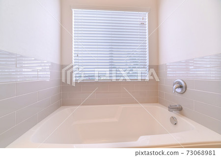 Compact bathroom interior with fitted bath with tile Compact bathroom interior with fitted bath with tile 73068981