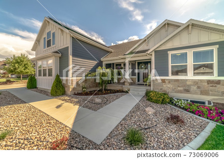 Neat front entrance to a house with pebbles 73069006