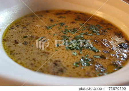 A plate of very tasty mushroom chowder with finely ground greens A plate of very tasty mushroom chowder with finely ground greens 73070290