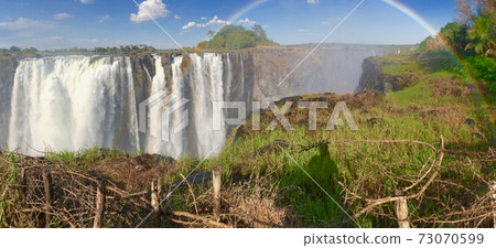 Panorama with Victoria Falls and rainbow Panorama with Victoria Falls and rainbow 73070599