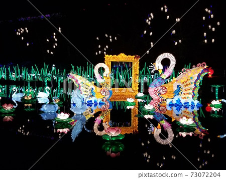 Illumination object of a fantastic swan floating on the surface of the water German Village 73072204