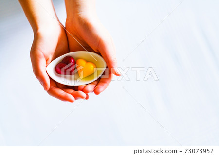 Valentine chocolate pair female hands [Valentine image] 73073952