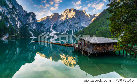 Lake Braies (Lago di Braies) in Dolomites Mountains, Boat hut on Braies Lake with Seekofel mount on background, Sunrise of Italian Alps, Naturepark Fanes-Sennes-Prags, Dolomite, Italy, Europe. 73075140