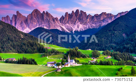 Santa Maddalena village, Dolomites mountains in background, Famous alpine place Santa Maddalena village, Val di Funes valley, Trentino Alto Adige region, Italy, Europe Santa Maddalena village, Dolomites mountains in background, Famous alpine place Santa Maddalena village, Val di Funes valley, Trentino Alto Adige region, Italy, Europe 73075152