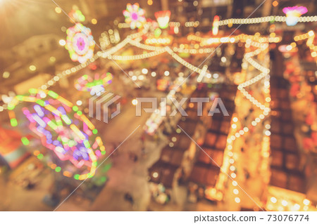 blur colorful night light market festival  caravan event for background. 73076774