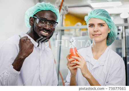 portrait of mix race worker in food and drink factory happy worker together looking camera and smile portrait of mix race worker in food and drink factory happy worker together looking camera and smile 73077081