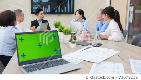 meeting with green screen laptop 73078219