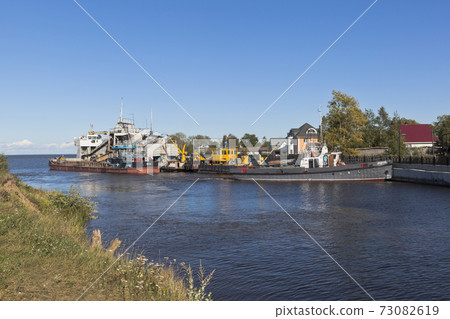 Vessels of technical fleet at the entrance to Belozersky bypass canal from the White Lake near the town of Belozersk Vologda region Vessels of technical fleet at the entrance to Belozersky bypass canal from the White Lake near the town of Belozersk Vologda region 73082619
