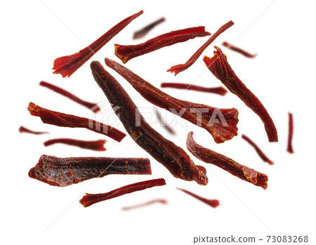 Saffron stamens levitate on a white background Saffron stamens levitate on a white background 73083268