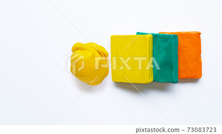Colorful plasticine clay on white background. Colorful plasticine clay on white background. 73083723