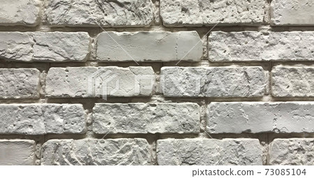 Grey brick wall texture background. Interior design concept with copy space Grey brick wall texture background. Interior design concept with copy space 73085104
