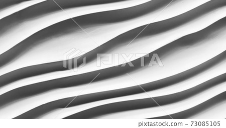 abstract striped of stone texture, curve sculpture. Close-up of black geometric shapes line abstract striped of stone texture, curve sculpture. Close-up of black geometric shapes line 73085105