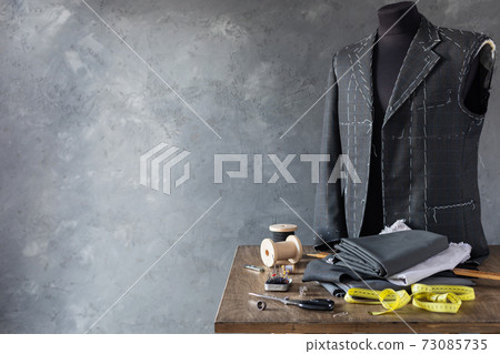 suit jacket on male tailor mannequin and sewing tools suit jacket on male tailor mannequin and sewing tools 73085735