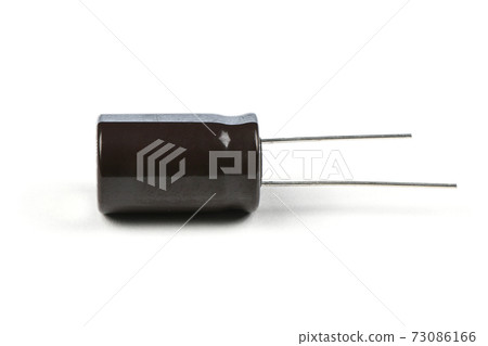 Electrolytic capacitor isolated on white Electrolytic capacitor isolated on white 73086166