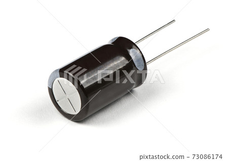 Electrolytic capacitor isolated on white Electrolytic capacitor isolated on white 73086174