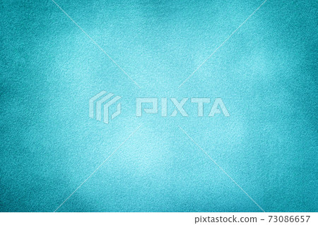 Blue matte background of suede fabric with vignette, closeup. Velvet textile. Blue matte background of suede fabric with vignette, closeup. Velvet textile. 73086657