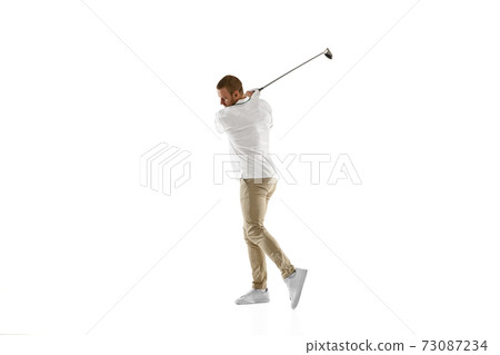 Golf player in a white shirt taking a swing isolated on white studio background 73087234