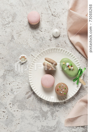 French sweet macaroons on the ligh table 73088268