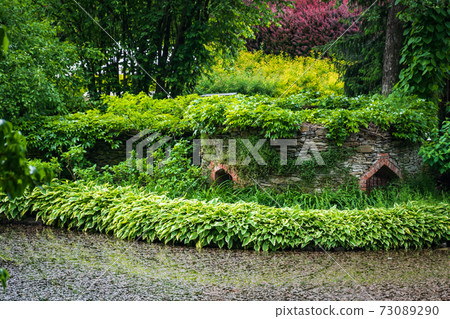 Shot of an old brick building in the garden, Wojslawice, Poland 73089290