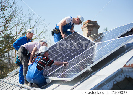 Installing solar photovoltaic panel system on roof of house Installing solar photovoltaic panel system on roof of house 73090221