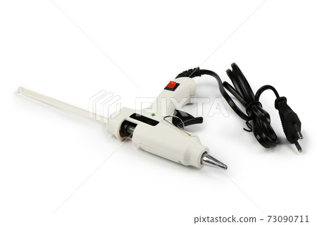 Electric hot glue gun isolated on white background. Electric hot glue gun isolated on white background. 73090711