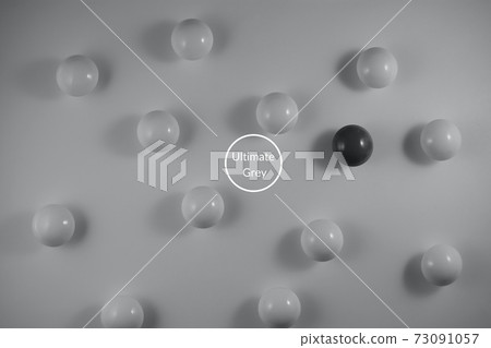 Light and dark balls on gray background 73091057