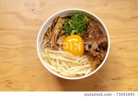 Sweet and spicy bowl of beef and egg sprouts 73091695