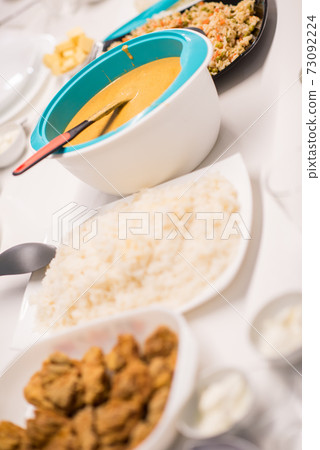 Beautiful ready lunch on dining table in modern home Beautiful ready lunch on dining table in modern home 73092224