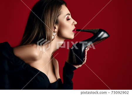 Profile of young woman with perfect makup in black Profile of young woman with perfect makup in black 73092902