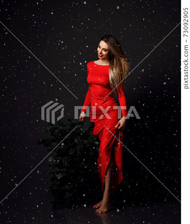 Young glamour woman in long red dress with winter 73092905