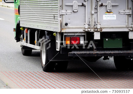 Logistics image Rear view of a light truck running on the road 73093537