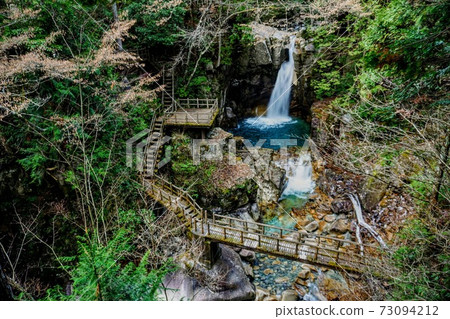 Evening forest park Ryujin no waterfall 73094212