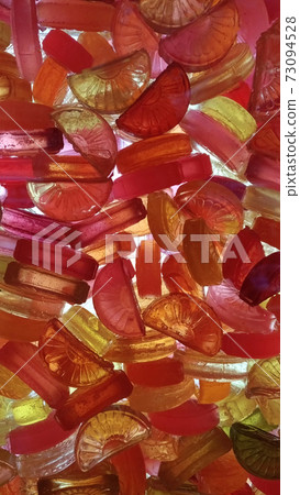Colored sweet candy in bulk against light Colored sweet candy in bulk against light 73094528