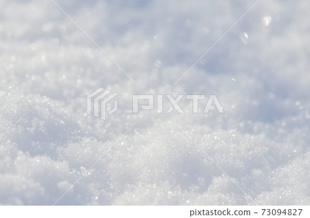 Background of fresh white snow. Natural winter background. Background of fresh white snow. Natural winter background. 73094827
