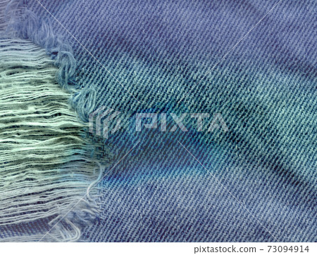 Blue denim jean texture background. Jeans torn fabric texture 73094914