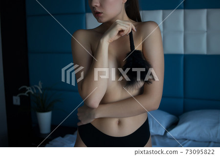 Crop woman petting nude breast with tickler Crop woman petting nude breast with tickler 73095822
