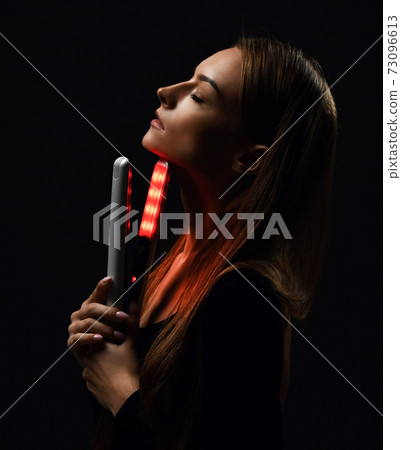 Sensual young woman with silky straight hair 73096613