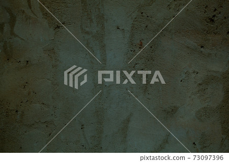 Grungy dark green wall with faded paint Grungy dark green wall with faded paint 73097396