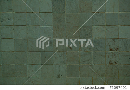 Background texture of a grey tiled wall 73097491