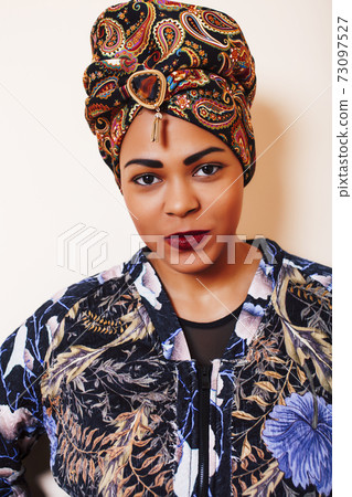 beauty bright african woman with creative make up, shawl on head like cubian closeup smiling beauty bright african woman with creative make up, shawl on head like cubian closeup smiling 73097527