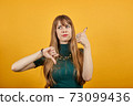 Human hand thumb down, no okay, angry face, negative gesture showing dislike 73099436