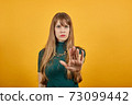 Palm arm raised air angry look straight you will not pass through facial harsh. 73099442